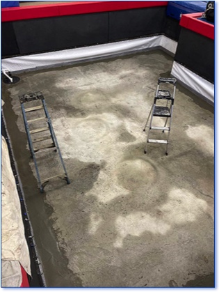 The finished pit at the gymnastics center, showing the cement in place.